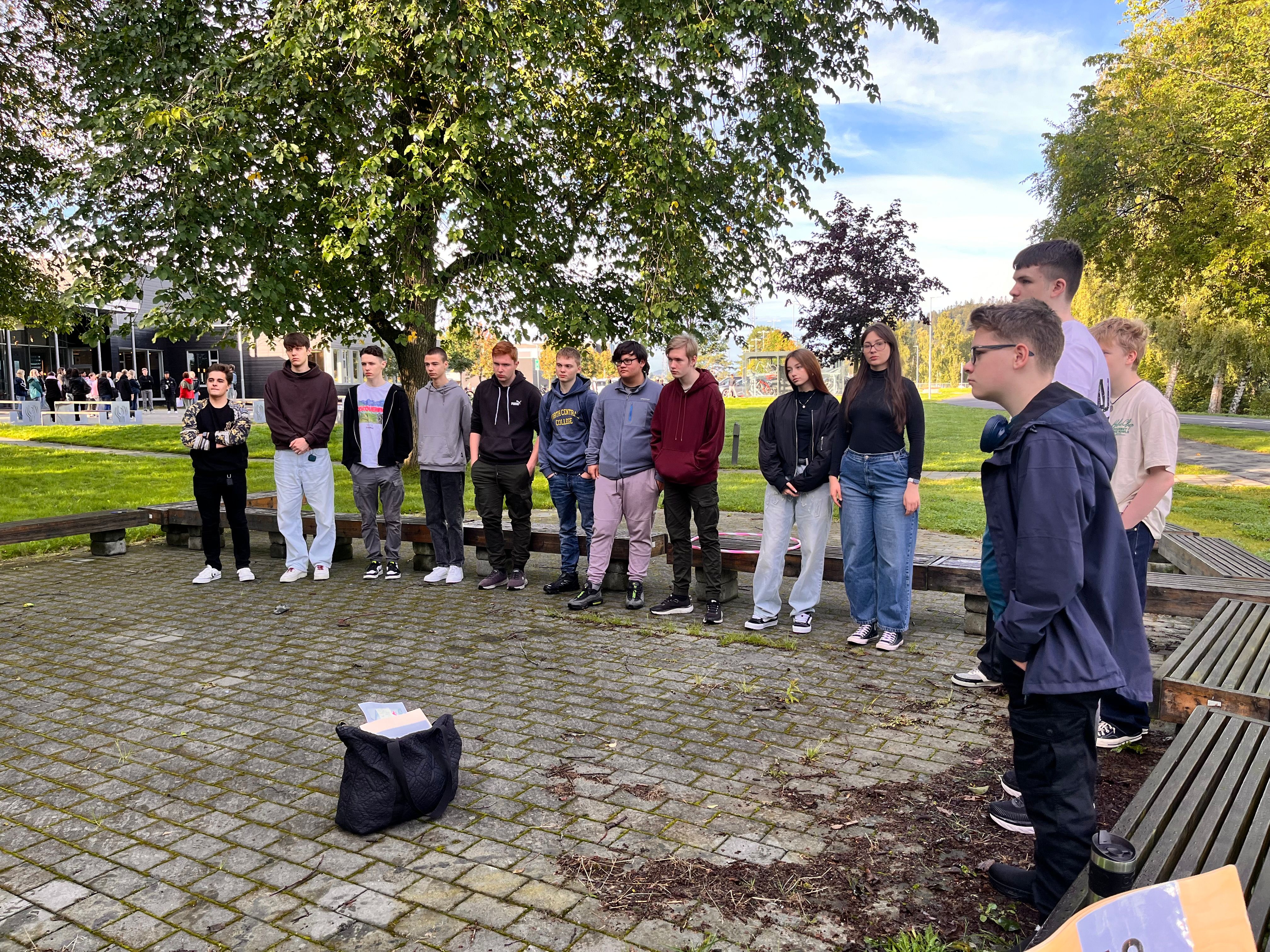 1IMA students gathered outside on campus